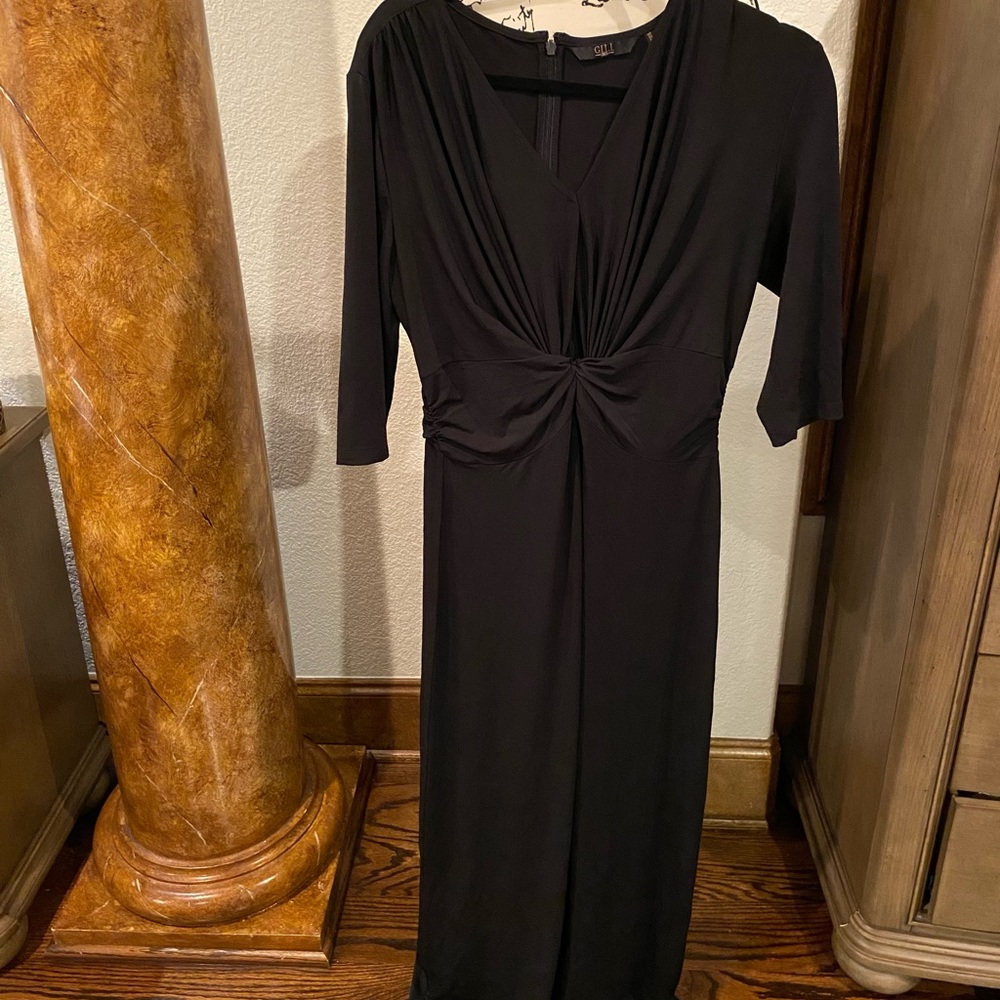 Black dress with 3/4 sleeves.  Beautiful knot detail. Never worn!!